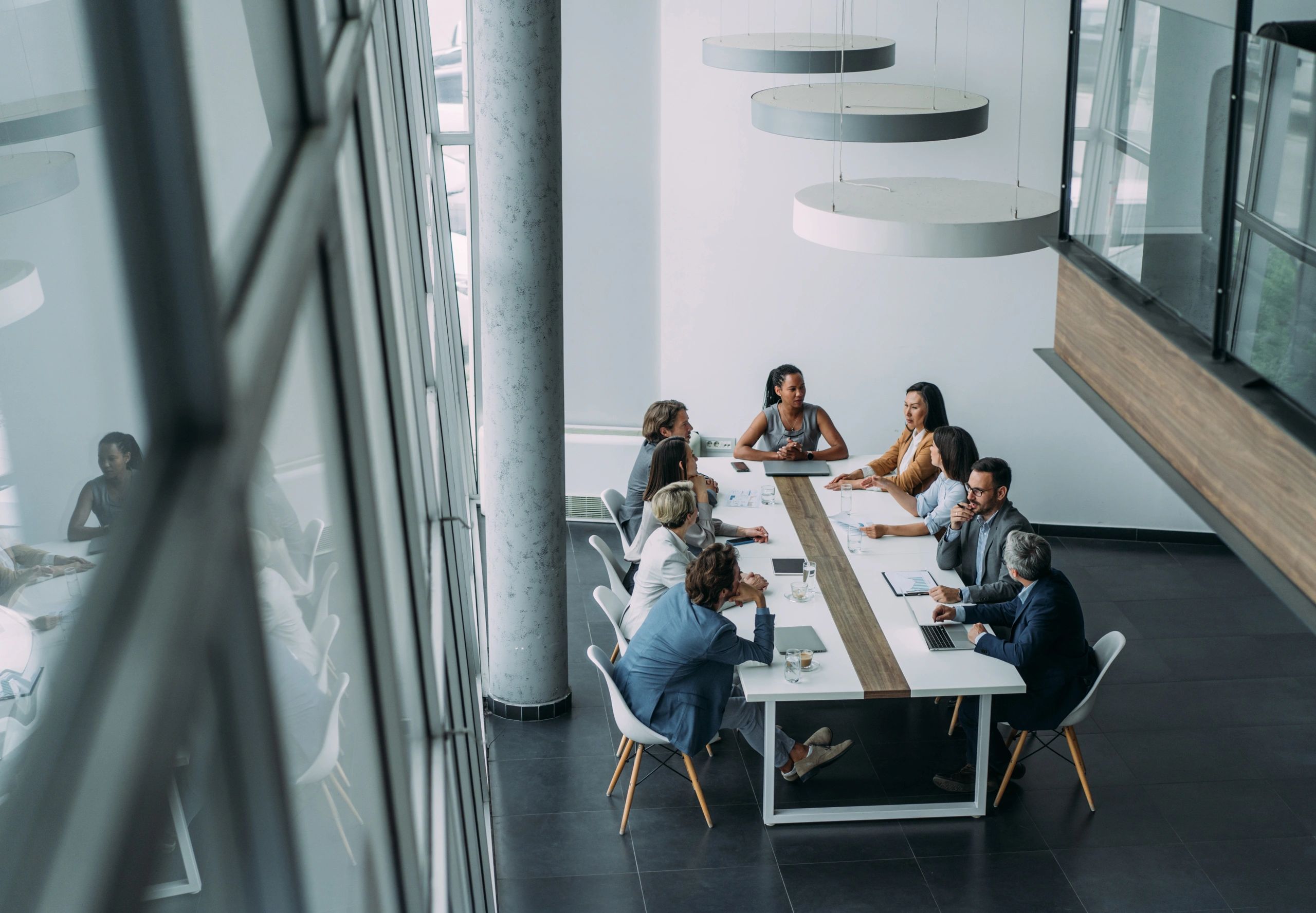 Boardroom discussion among business professionals