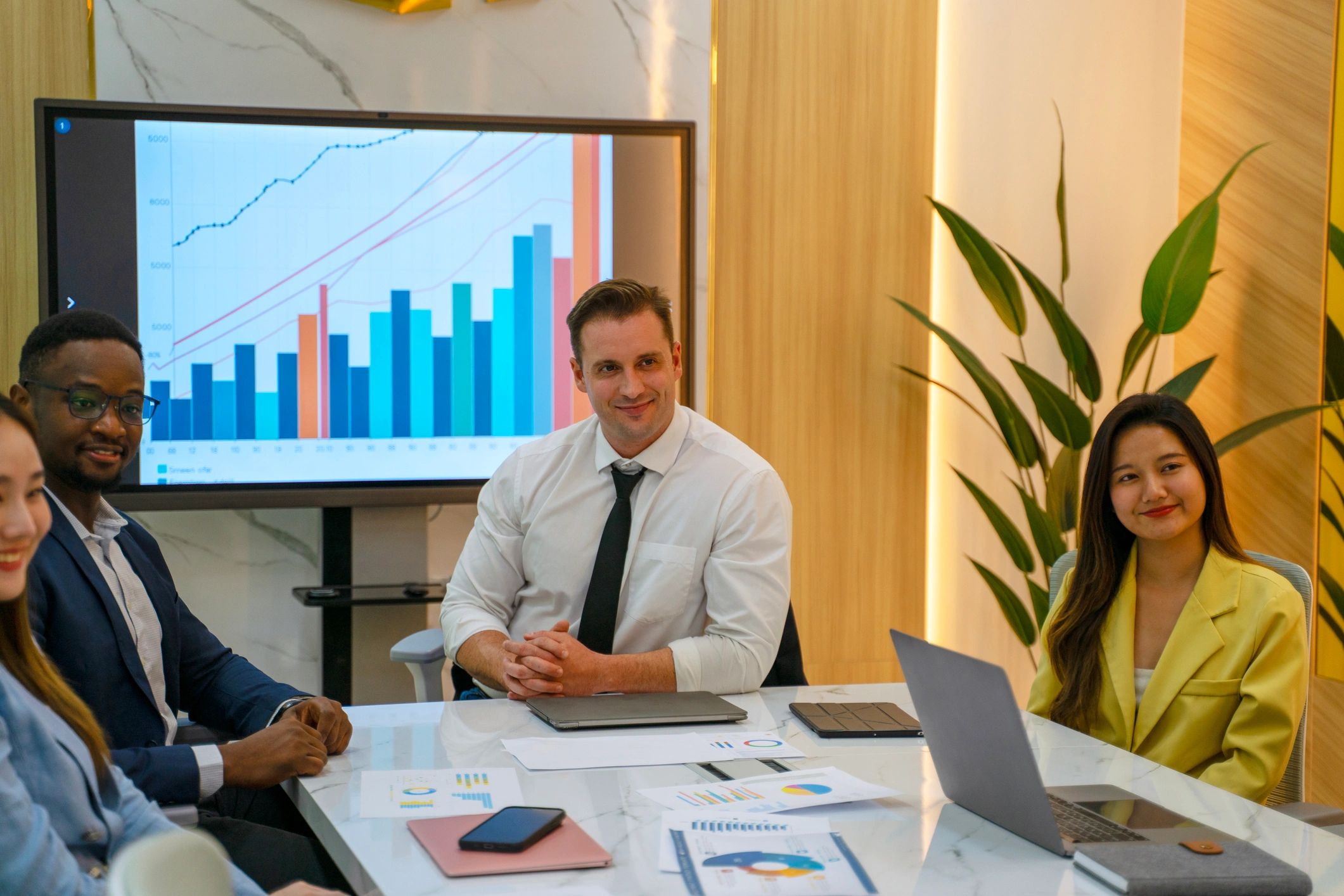 Corporate professionals meeting to review legal and compliance strategy